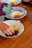 Woman prepares a vegan poke in a healthy eating workshop