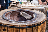 Traditional Georgian street food, baking khachapuri and tonis puri