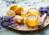 Jar of honey and fresh lavender flowers