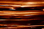 Shimmering close-up of a melted chocolate texture