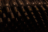 Traditional wine cellar in Kakheti with old, dusty bottles