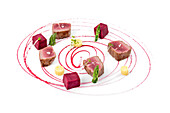 Beautifully plated red tuna with asparagus and beet sauce