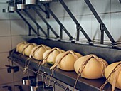 Mahon cheese row in a factory setting