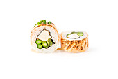 Two pieces of sushi on a clean white background