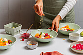 Preparing a peach dessert with ice cream in a modern kitchen