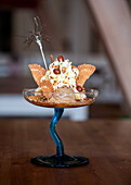 Gourmet ice cream sundae in elegant glass dish