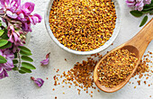 Healthy bee pollen grains. Bee pollen on a bowl and acacia flow