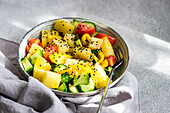 Colourful fresh vegetable salad in a bowl, from above