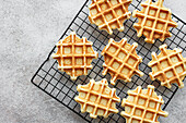 Freshly baked waffles on a baking tray