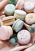 Beautiful colourful delicious macaroons on a textile background