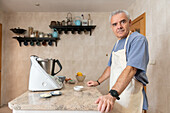 Elderly man preparing ingredients for the Epiphany cake