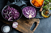 Fresh vegetable salad ingredients on a rustic kitchen setup