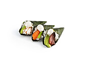 Handmade temaki sushi with fresh ingredients on white background