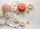 Autumn composition from above with pumpkins in a shopping bag