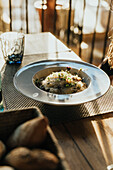 Elegant wedding dinner plate with gourmet pasta meal