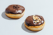 Chocolate-Covered Donuts with Peanut and Chocolate Sprinkle Toppings