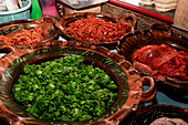 Traditional Mexican dishes served in earthenware pots