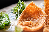 Delicious baked cheese dish on the surface of a cream soup