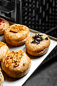 Assortment of gourmet vegan cream donuts in various flavors