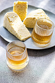 Sulguni cheese and amber-coloured wine against a light background