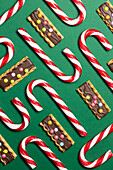 Various Christmas sweets on a green background