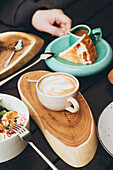 Breakfast scene with coffee and quiche in a modern café