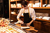 Chocolate saleswoman packing products