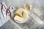 Georgian sulguni cheese and amber wine on a rustic table