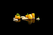 Artistic presentation of gourmet Asian dessert on black