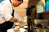 Chef at work in a busy restaurant kitchen