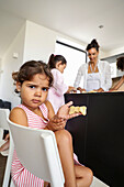 Family baking biscuits together in a modern kitchen