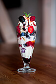 Gourmet ice cream sundae topped with fresh berries