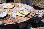 Traditional Georgian cheese breads being prepared outdoors