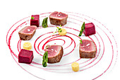 Red tuna steaks with asparagus and artistic beet sauce