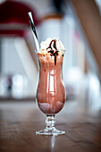 Tasty chocolate milkshake topped with whipped cream