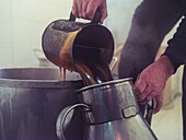 Traditional production of palo liqueur in Mallorca