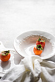 Elegant autumnal table setting with fresh persimmons