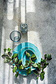 Top view of feijoa fruit arranged on a turquoise table setting