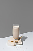 Glass of tigernut horchata on a minimalist background