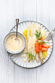 White asparagus with salmon and light hollandaise sauce