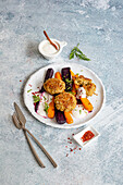 Colourful carrot vegetables with green spelt patties
