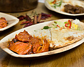 Butter chicken with naan bread and rice
