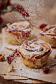 Apple and cinnamon roses made from puff pastry with icing sugar