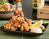 Japanese karaage with chicken, served with lemon and mayonnaise