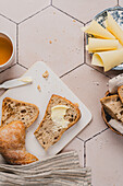 Breakfast with baguette, butter, cheese and tea