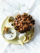 Baked artichoke alla giudia with dip