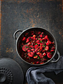 Red vegetable and potato soup with pumpernickel wedges