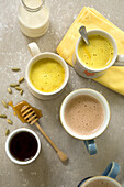 Golden milk with cardamom and honey and mocha coffee