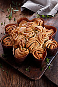 Rose-look herb bread in a baking tin