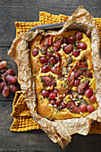Pumpkin focaccia with bacon, figs and grapes